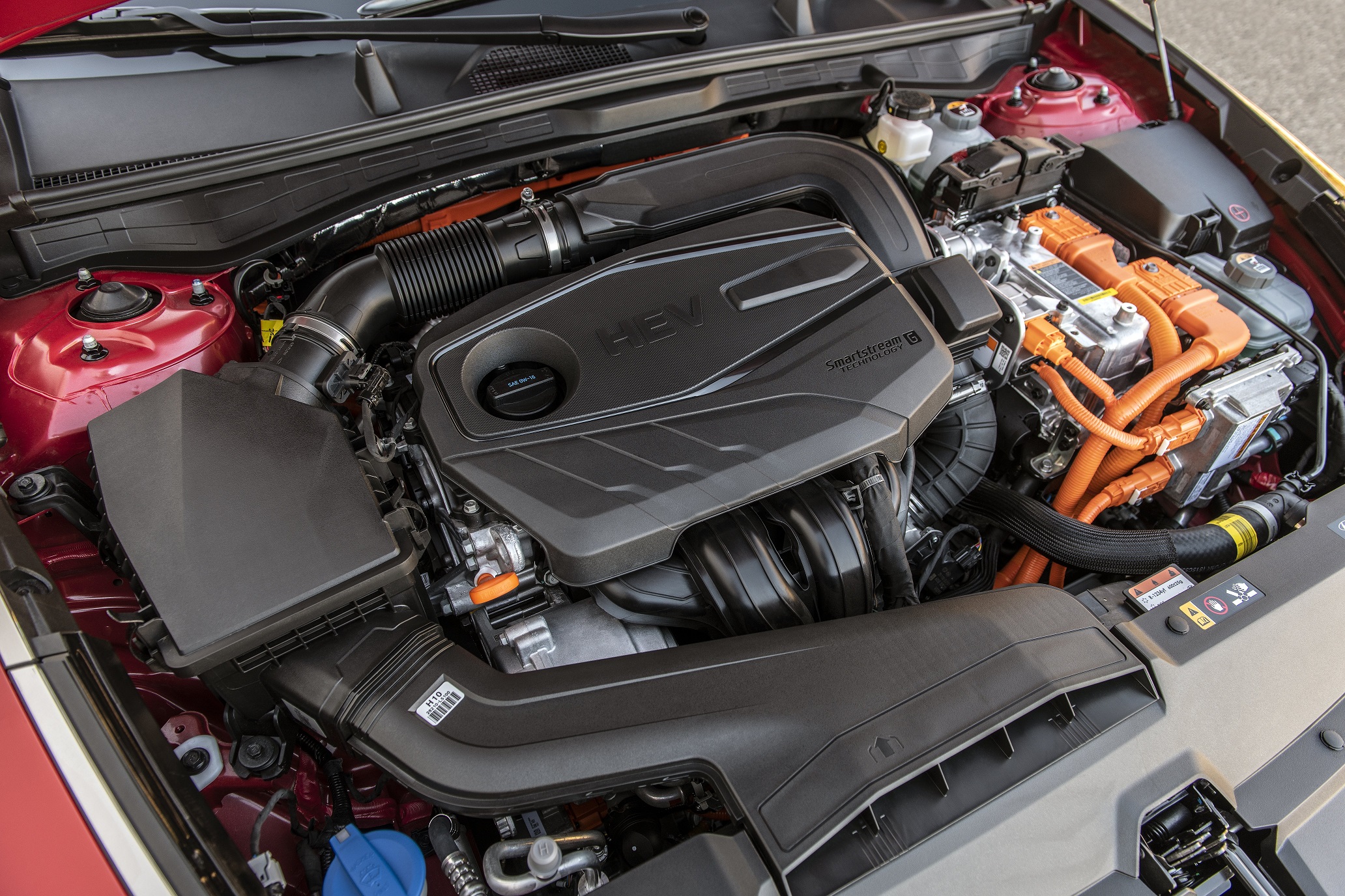 The open hood shows Hyundai’s Smartstream G2.0 direct-injection four-cylinder gas engine 