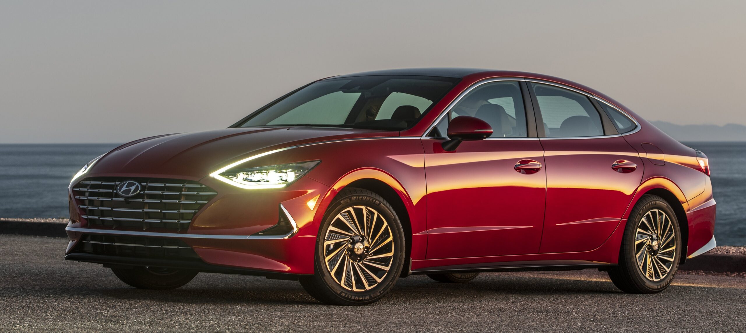 A horizontal photo of a red sonata