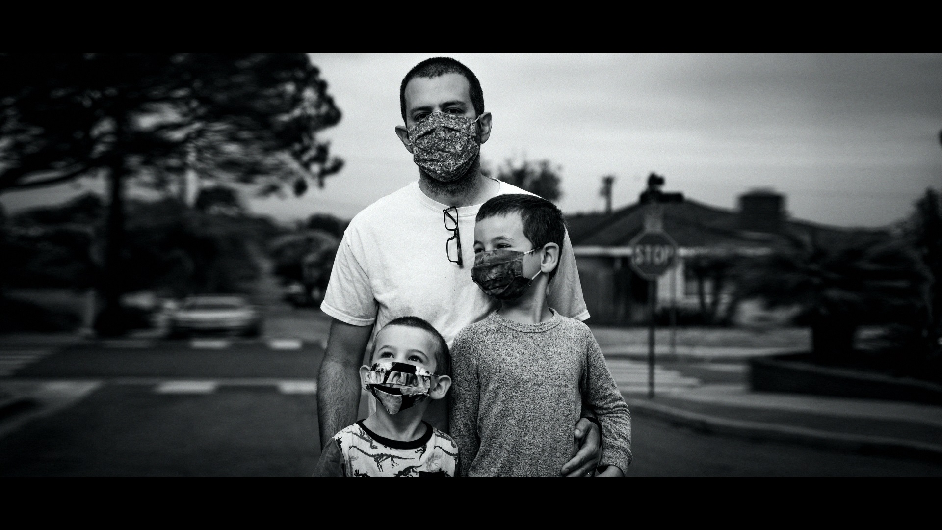 A black and white image of a father and his 2 sons for the Finish Strong campaign