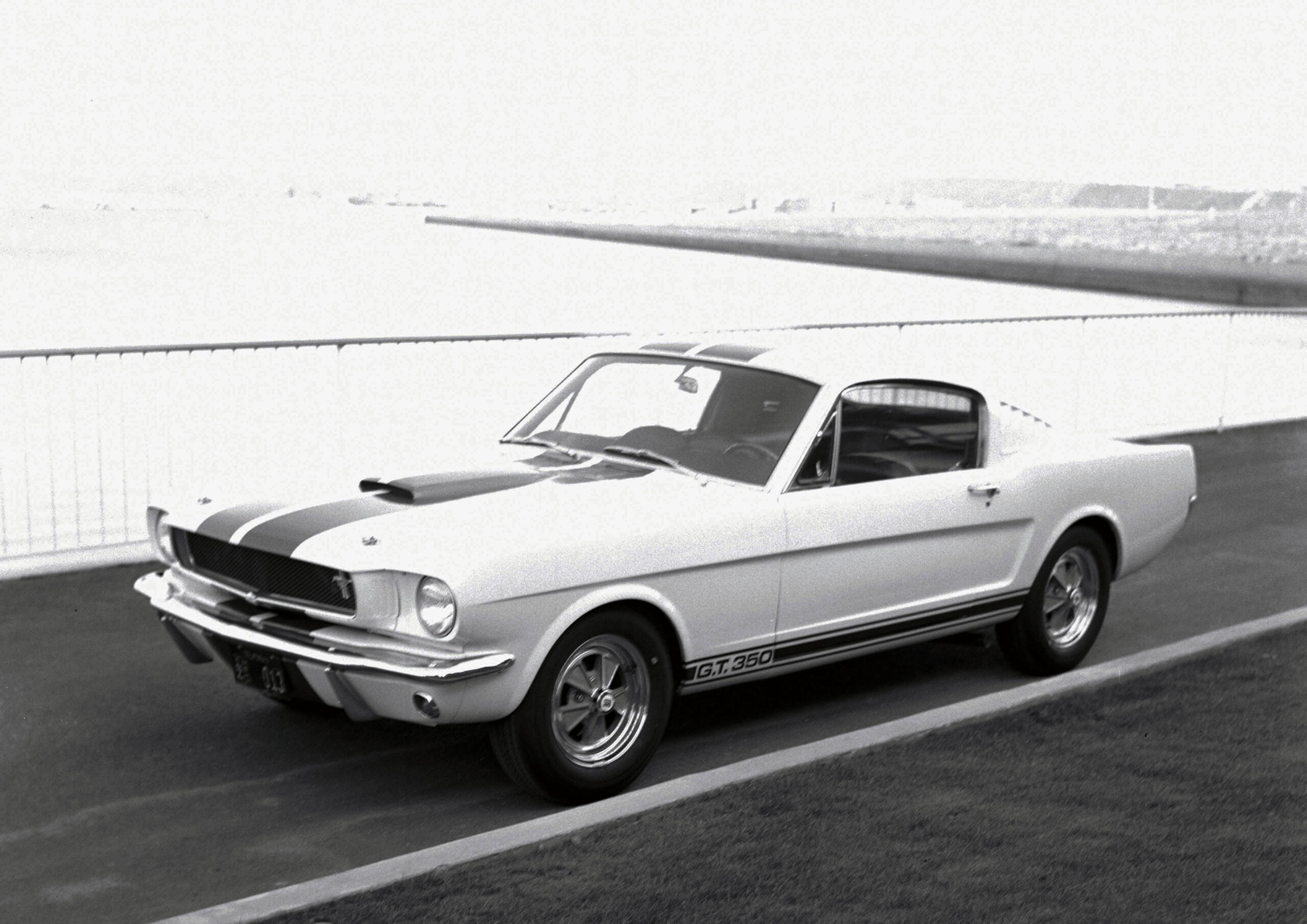 A black-and-white vintage image of a 1965 Ford Shelby GT350