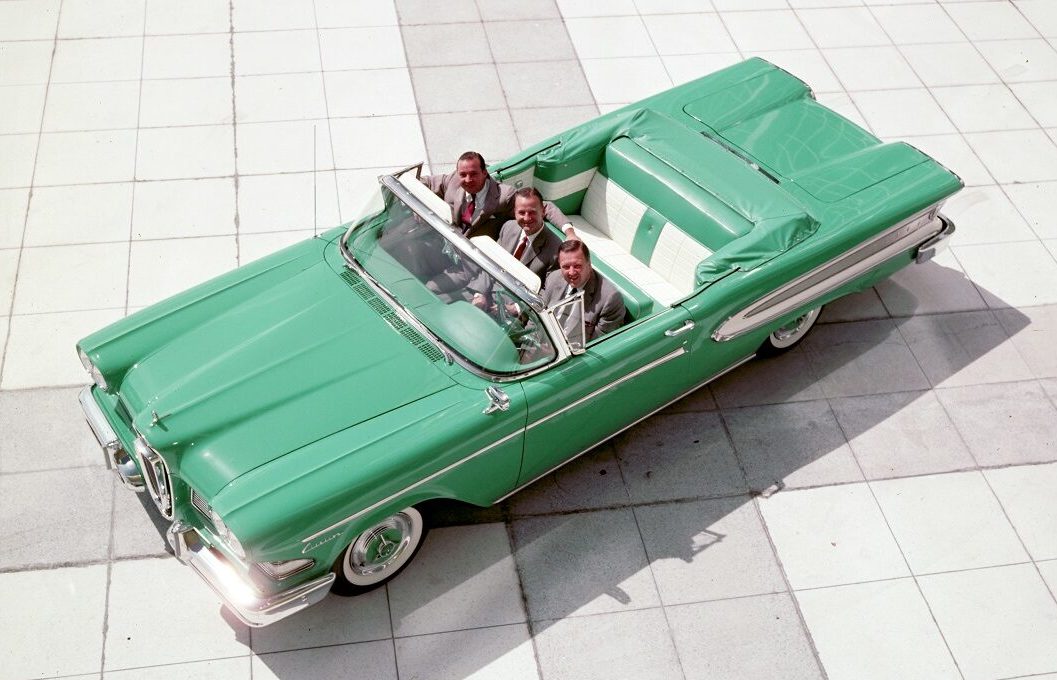 Three Ford executives sitting three across in the 1958 Edsel convertible.