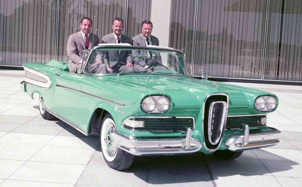 1957 Ford execs pose in a top-down Edsel convertible: William Clay Ford senior, Benson Ford, and Henry Ford II at the launch of the Edsel brand and car in 1957.