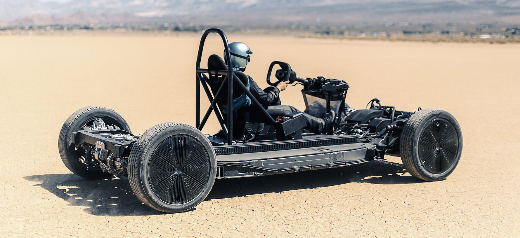 The SkateKart illustrates how the Canoo platform can be driven without a 'top hat' cabin. 