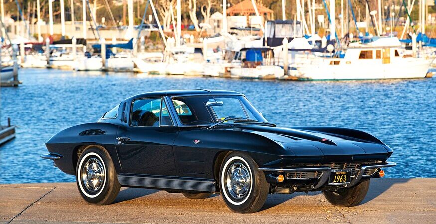 A black 1963 Corvette along Mission Bay in San Diego