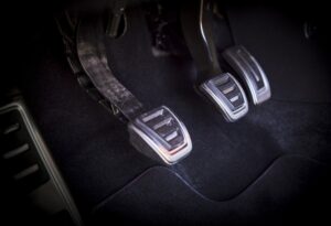 The 3 chrome-trimmed clutch, brake, and gas pedals.