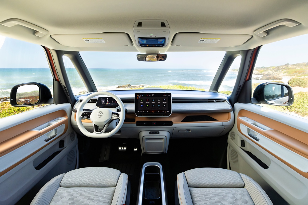 looking out the windshield with a full view of the dashboard and an ocean view beyond