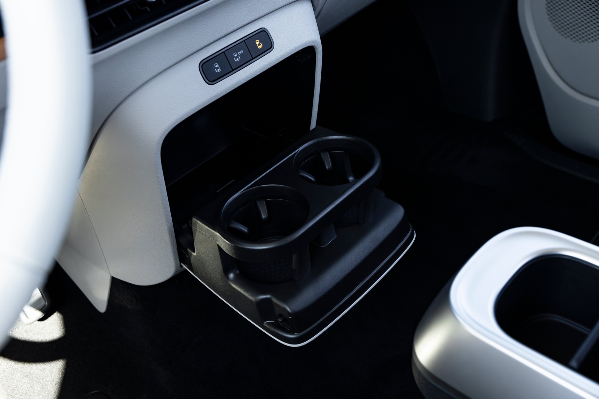Dual drop-down front cup holders.
