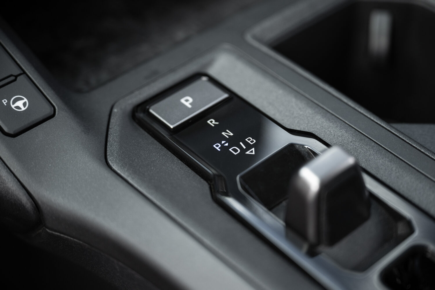 The Limited has a toggle switch shift-by-wire gear selector.