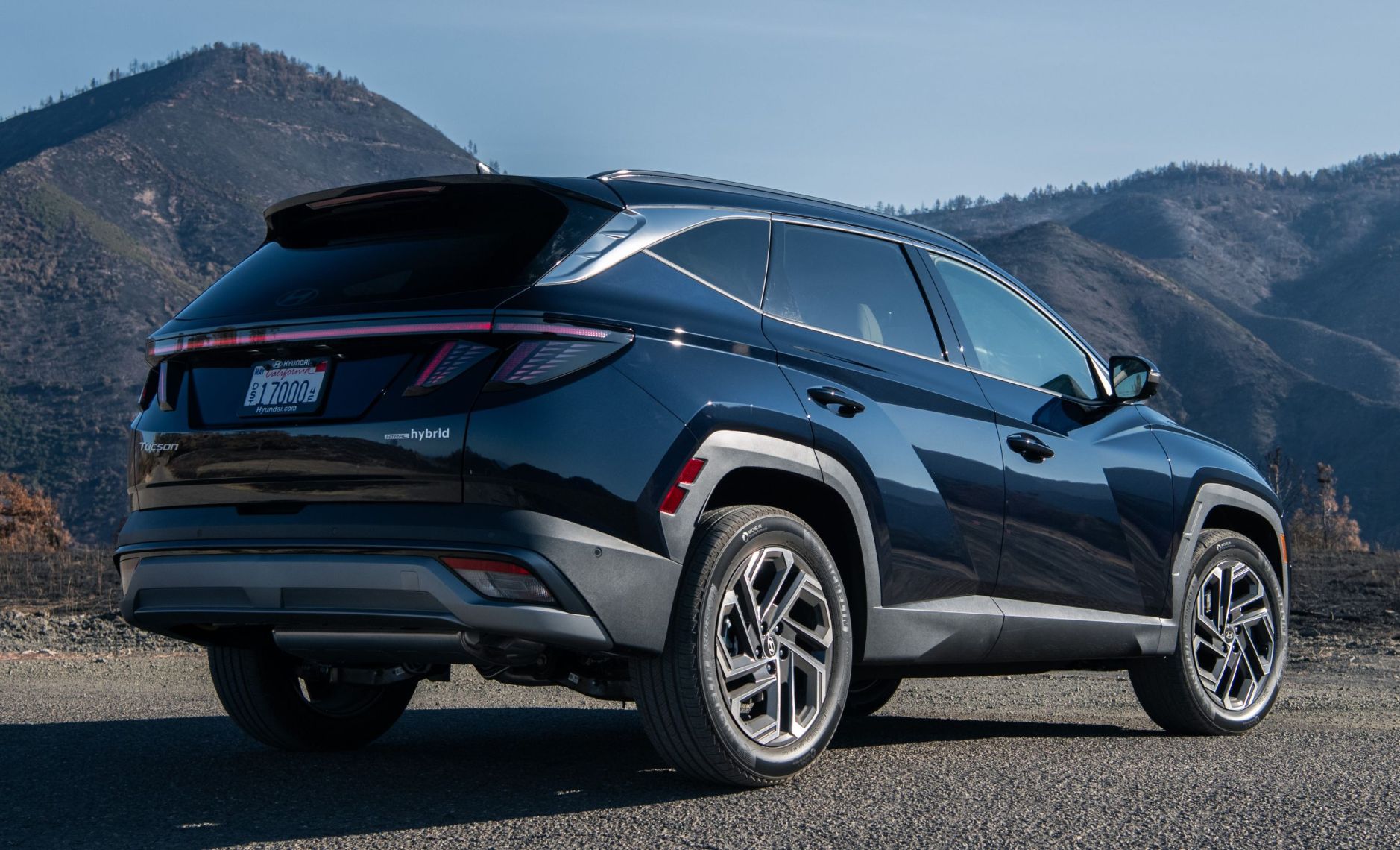 A rear view of a black Tucson Hybrod SUV