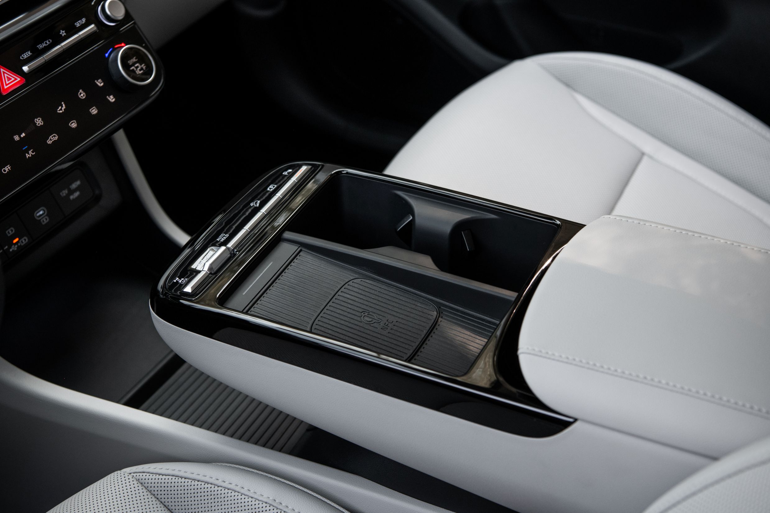 Looking down at the front center bridge console with wireless charging pad
