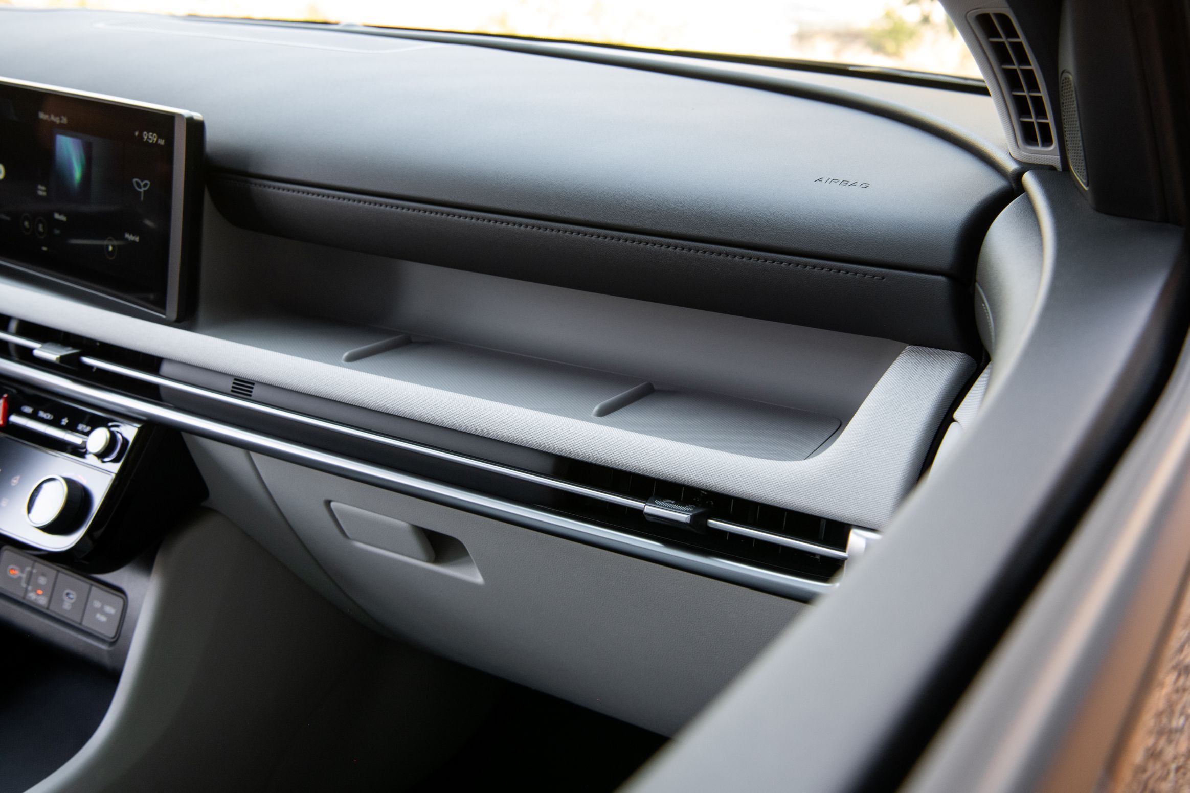 A segment shelf in the Tucson's instrument panel where a passenger could lay a phone