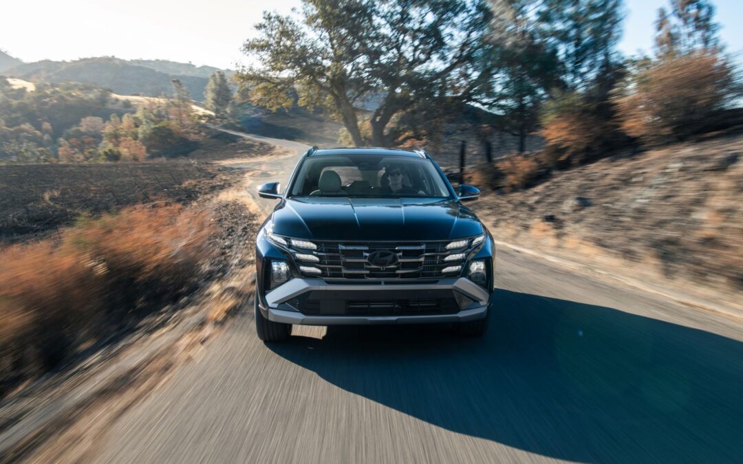 Looking into a tucson hybrid driving along a backcountry road