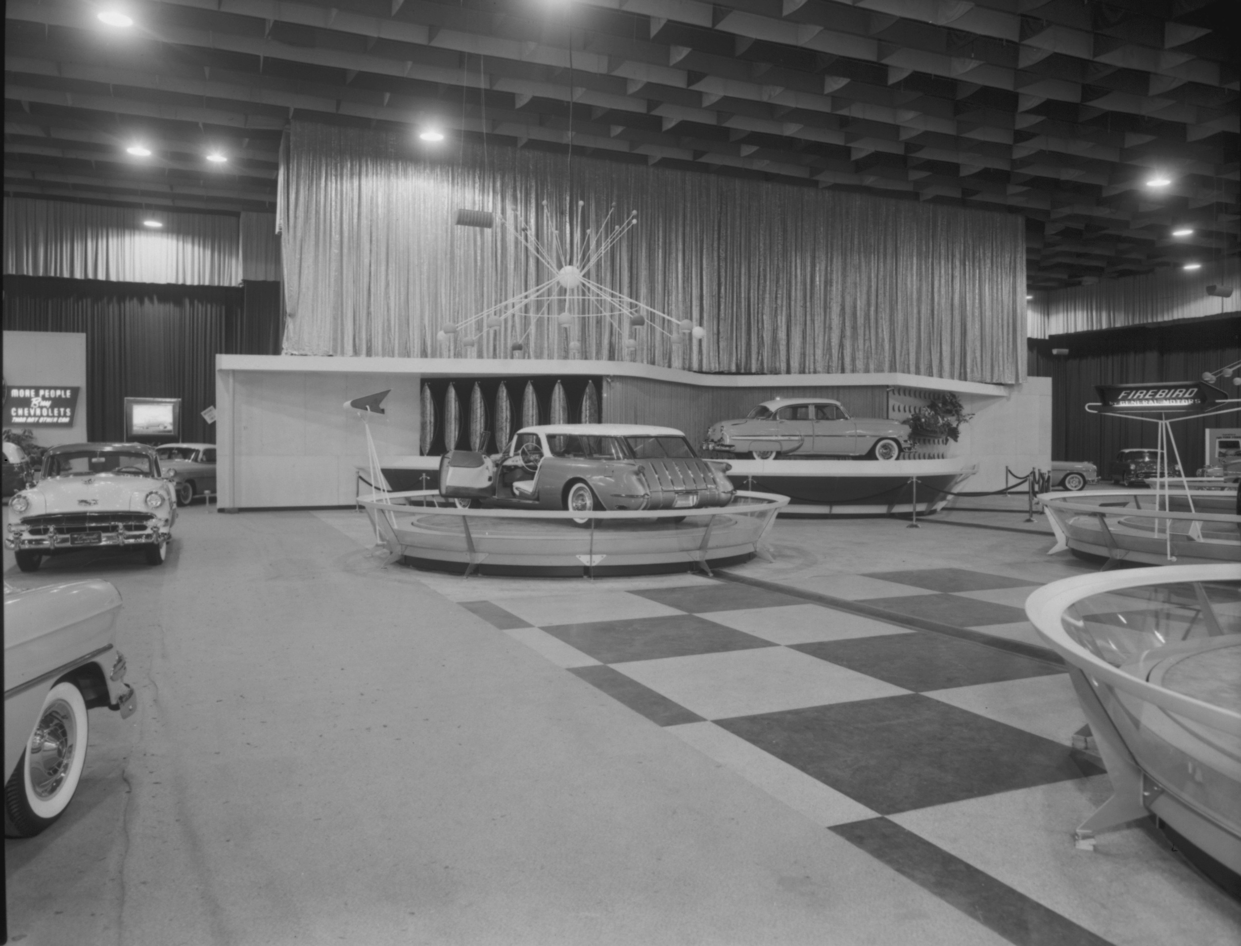 A black and white image of A 1954 Chevrolet Motoramic auto show display.