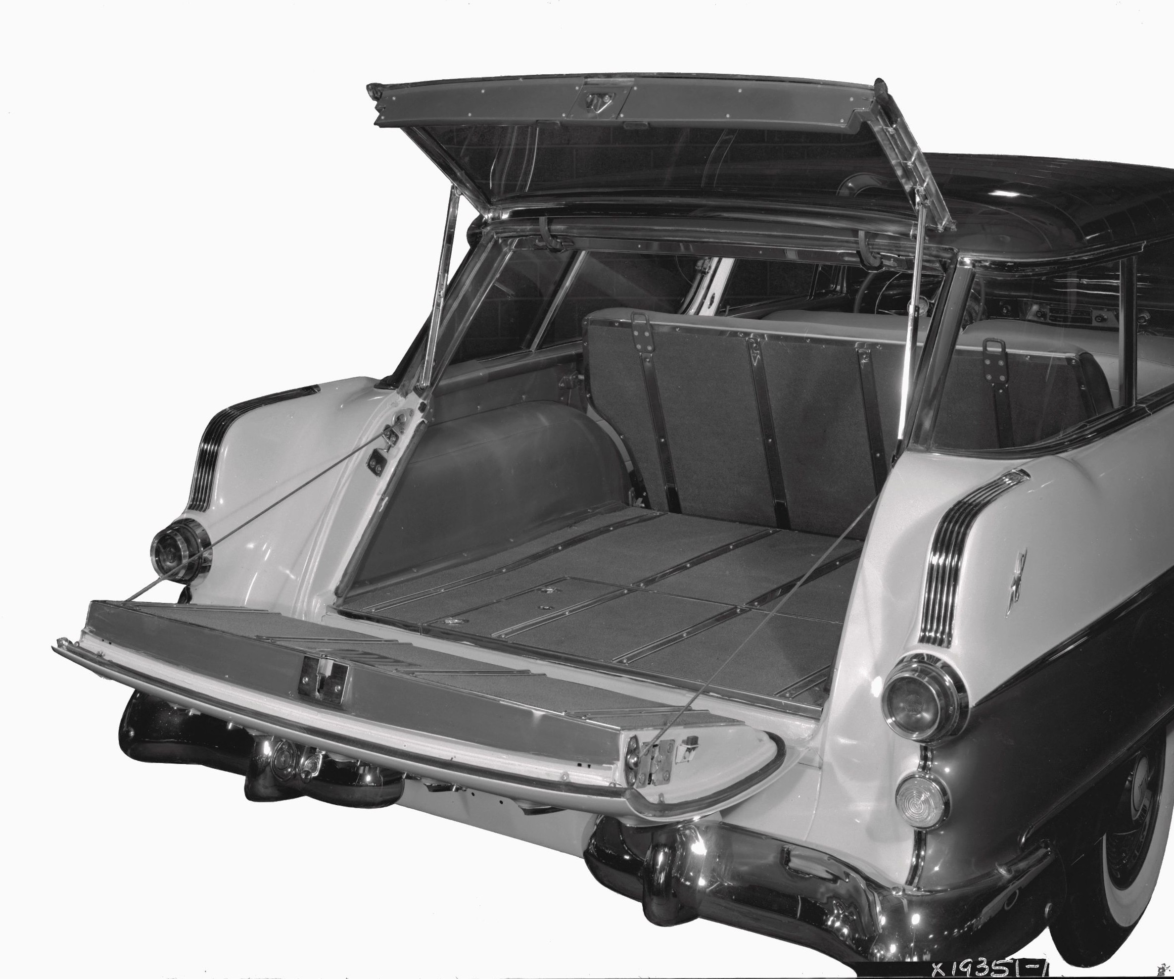 A black and white image showing the open split tailgate