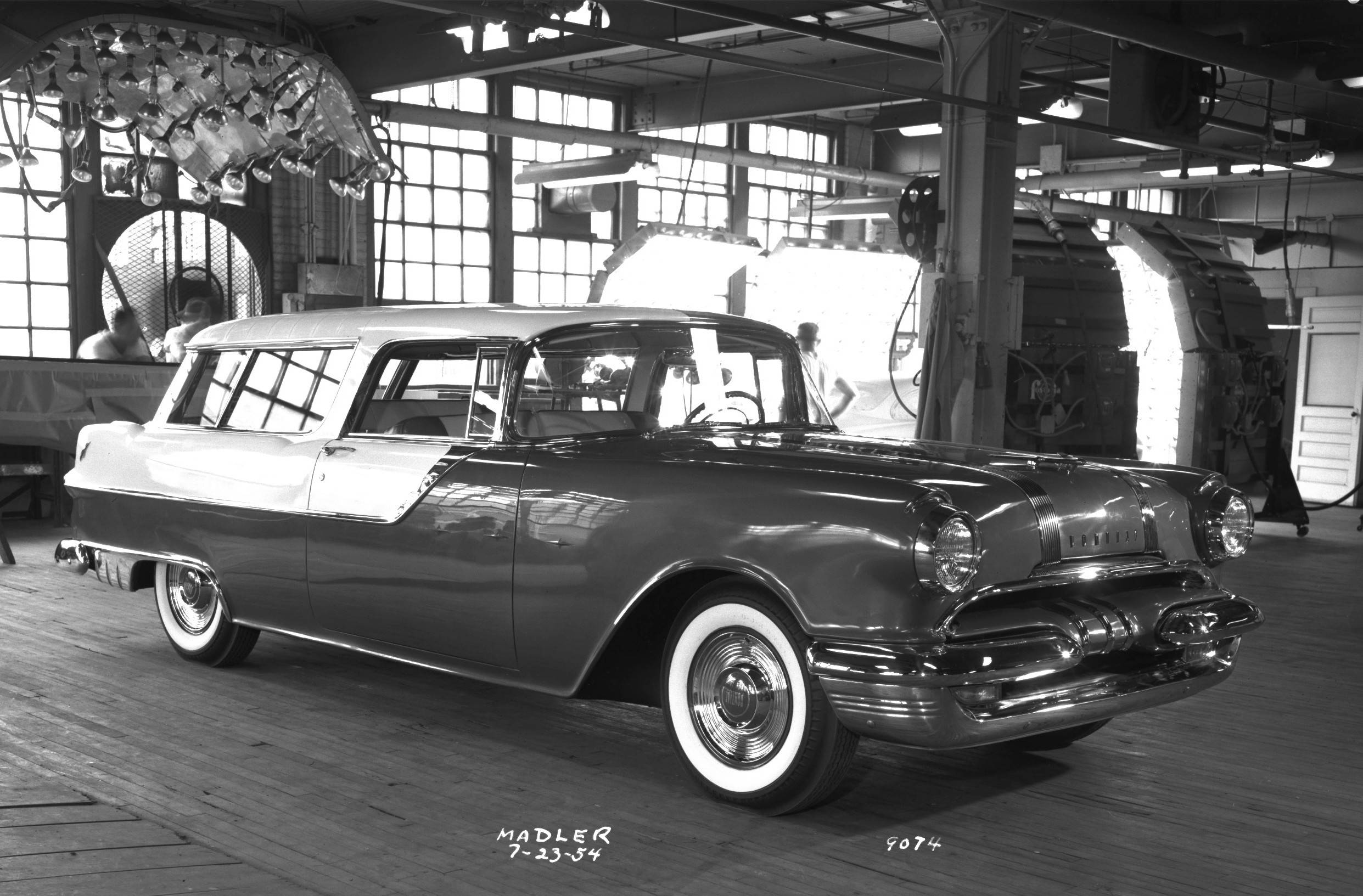 A black and white image in a paint curing booth of a two tone Safari