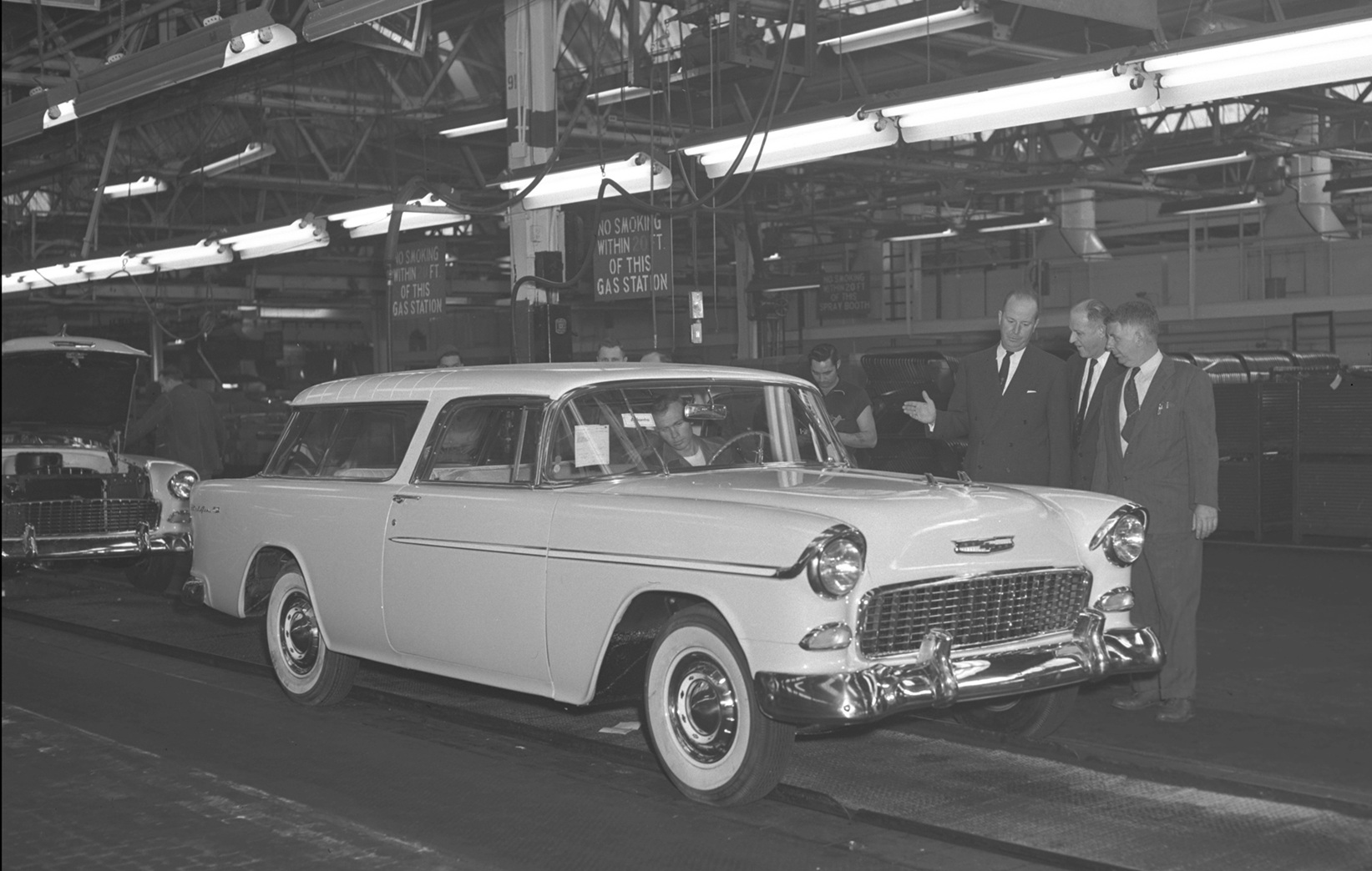 1955 Chevrolet Nomad on the Cleveland production line with three GM execs including Harley Earl.
