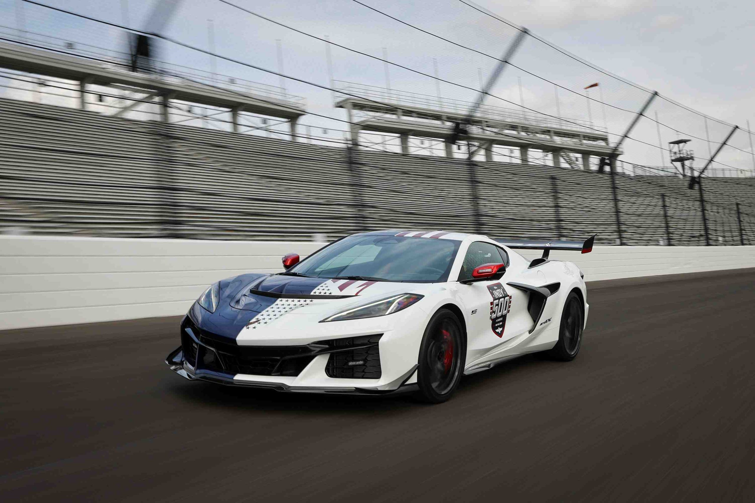 For the Pace Car role, the Corvette ZR1X features the Carbon Aero package: dive planes, underbody aero strakes, and a rear wing generating over 1,200 pounds of downforce at speed.