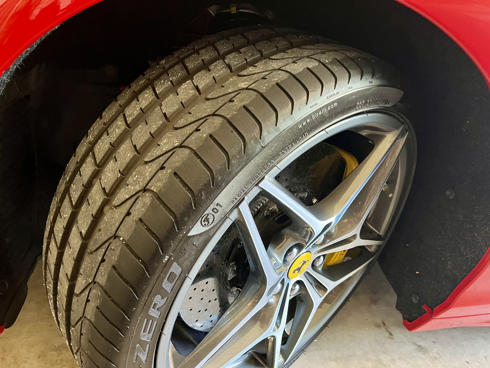 Looking at the Ferraris' substantial tread on the Pirelli p zero front tires