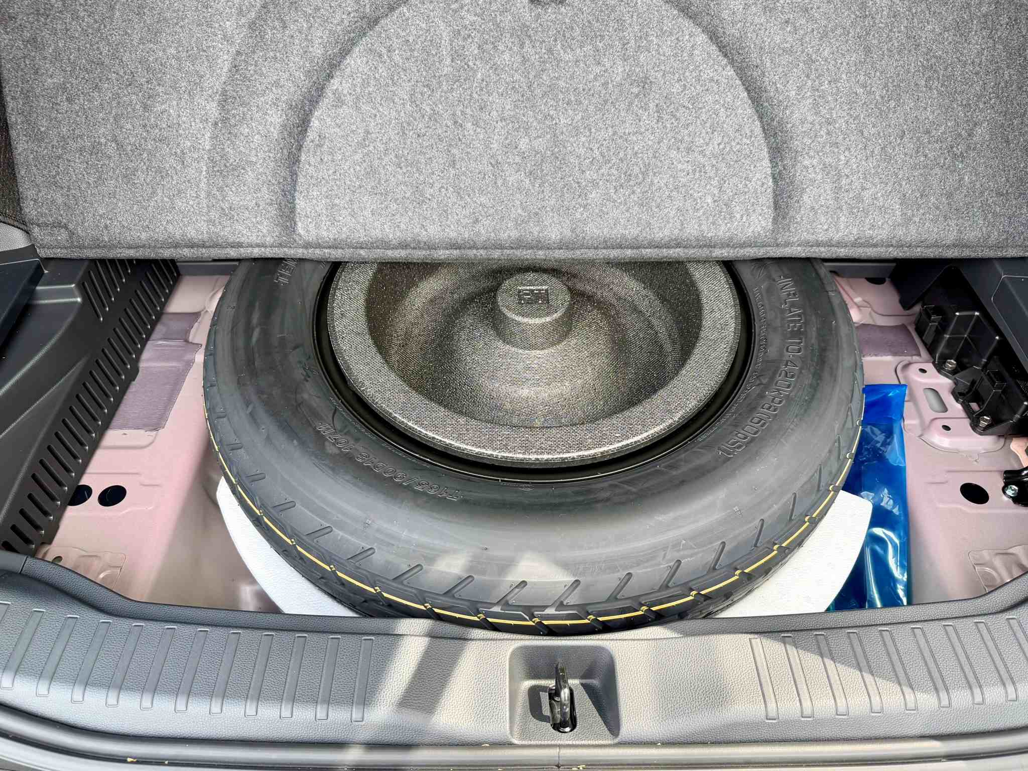 Looking at the temporary spare tire under the cargo floor