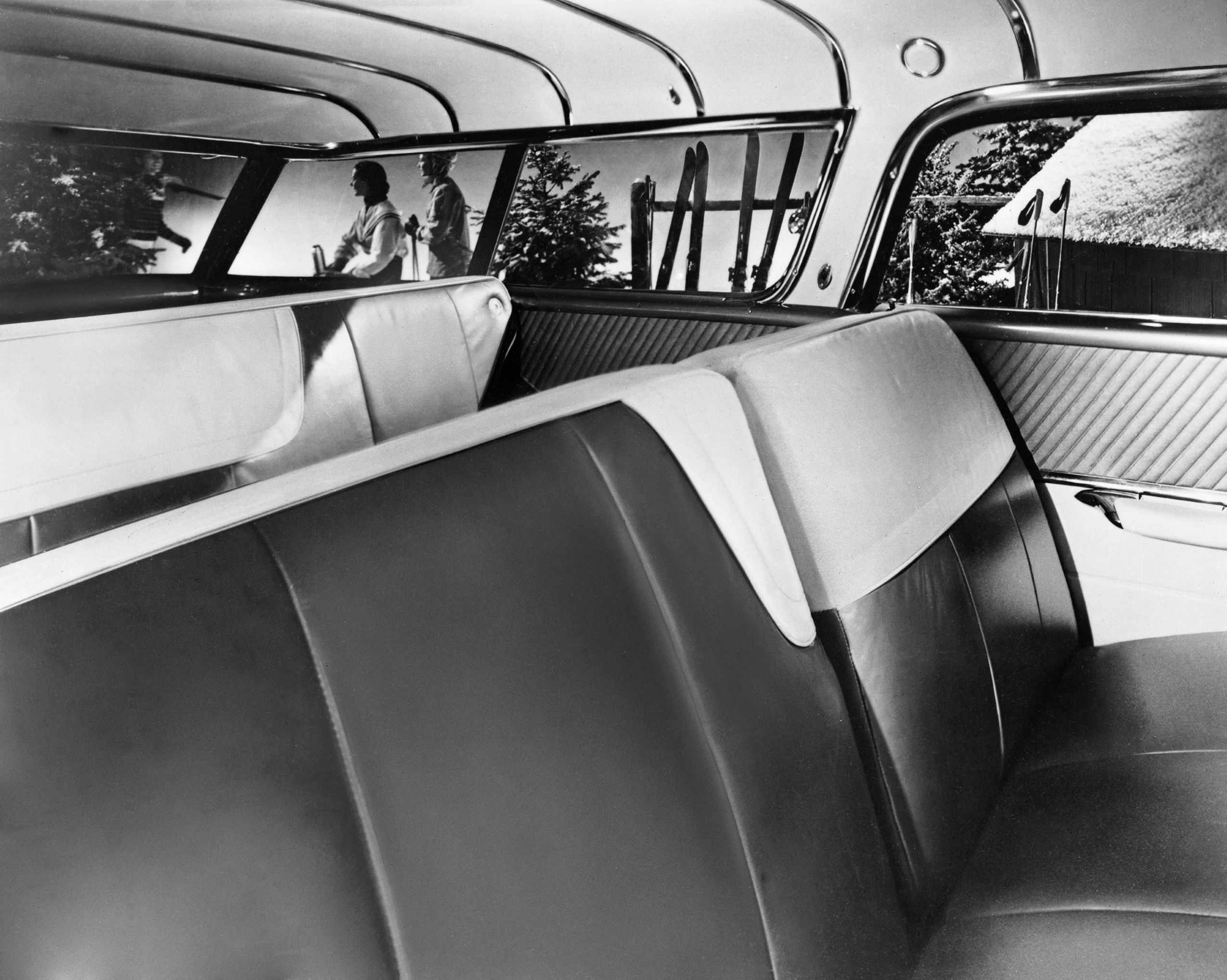 A black and white back seat interior view of a Pontiac Safari.
