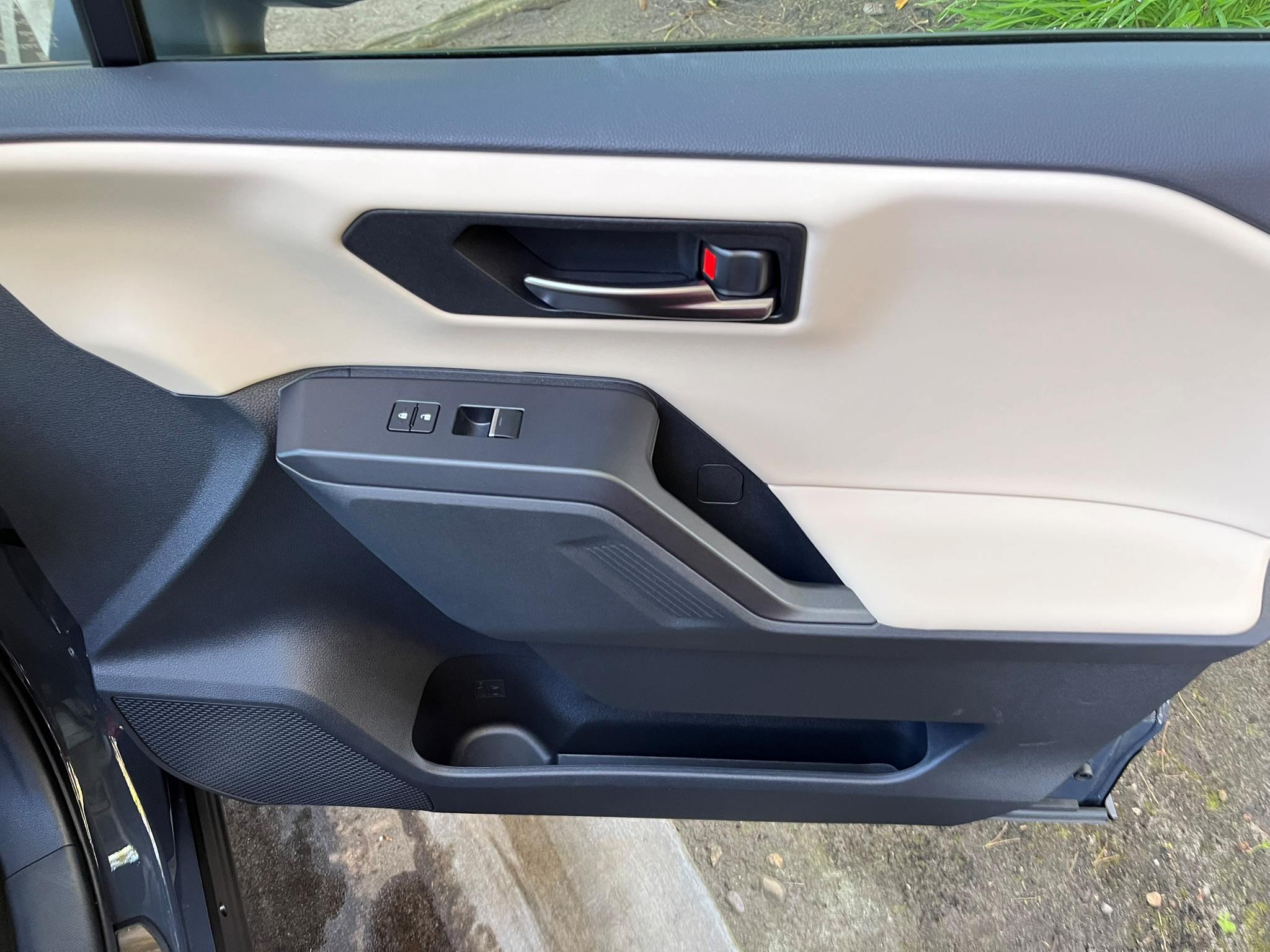 Looking at the front inside passenger door of the RAV. The door grab is an ideal position for good leverage.
